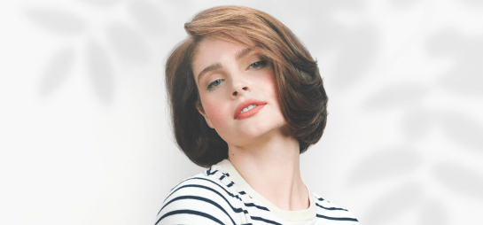 female with strawberry blonde, short haircut