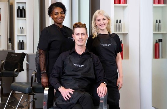 3 Stylists standing in salon